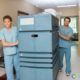 healthcare professionals with medical linen cart